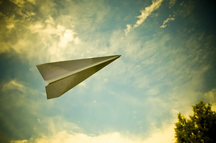 Free wallpaper of a paper rocket in the sky suitable for laptops and computers