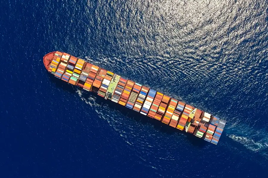 Interesting profile of a colorful cargo ship at sea in excellent Full HD quality