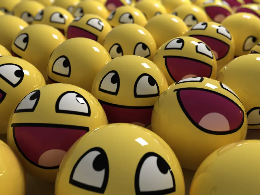 A photo of funny emojis with big eyes and a red tongue 