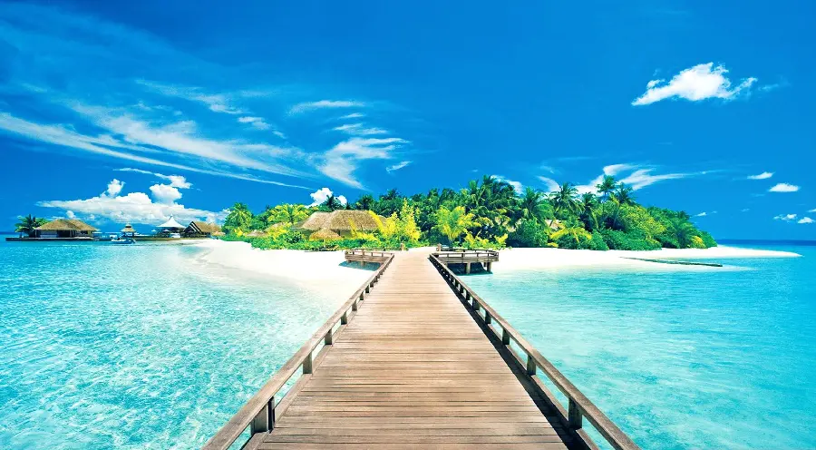 Summer landscape photo of a wooden island bridge and the pristine sea