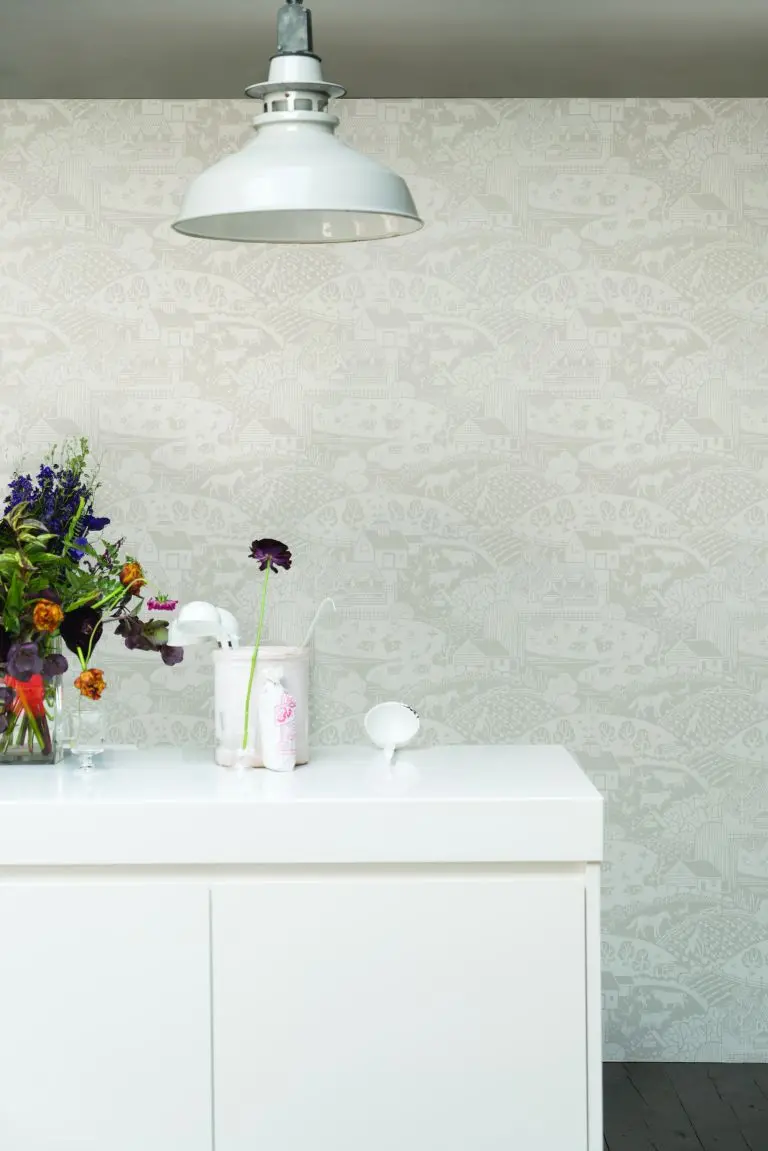 Photo of a beautiful white cabinet with colorful flowers on it 
