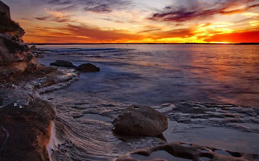 A beautiful rocky beach with a sunset view in Bandar Abbas