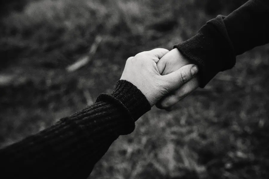 Black and white hand-holding picture for profile