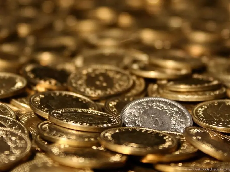 Download stock photo of gold coins stacked on top of each other