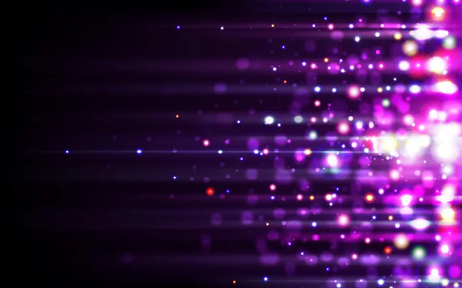 Wallpaper of luminous particles with colorful glowing spots on a black background in romantic themes
