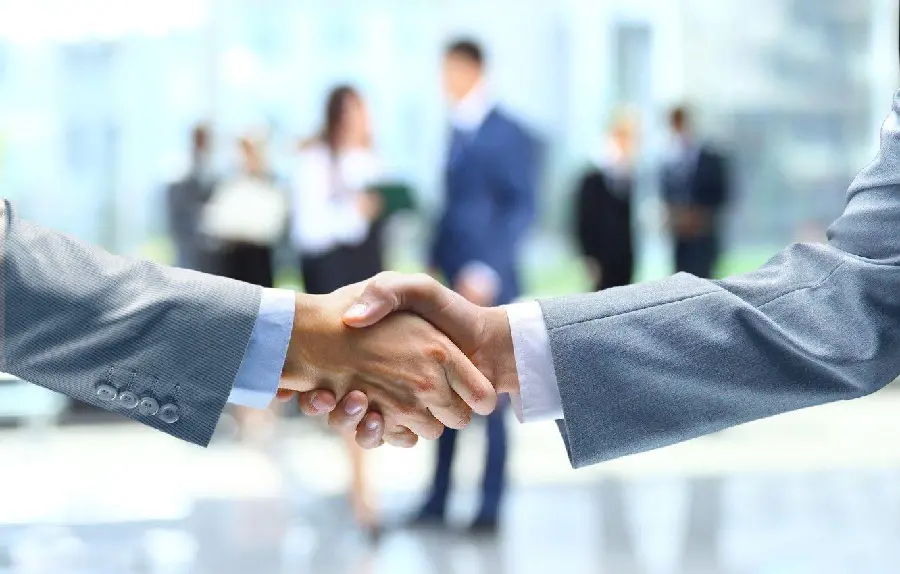 Download photo of the first slide of a business PowerPoint, image of handshake and agreement 