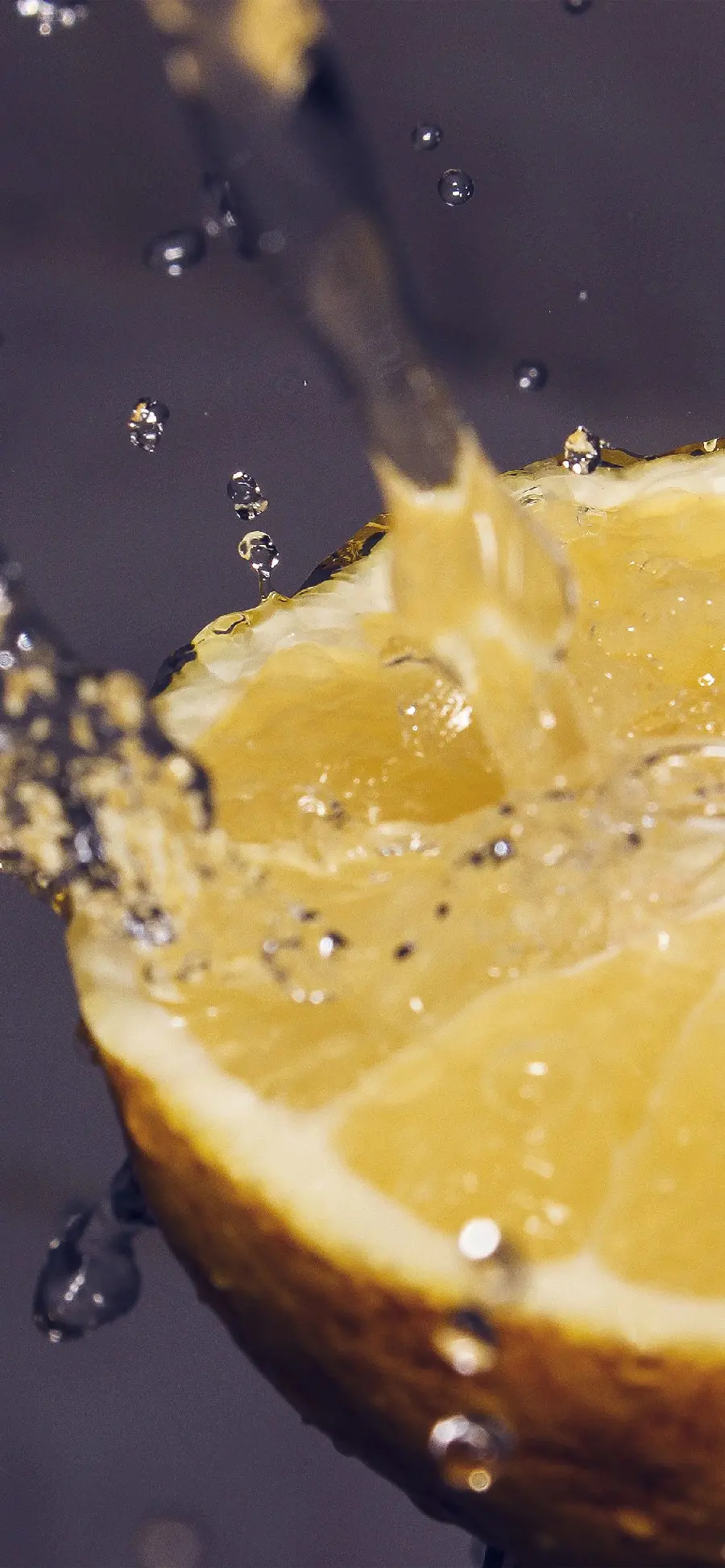 Image of capturing moments in water droplets on a lemon slice