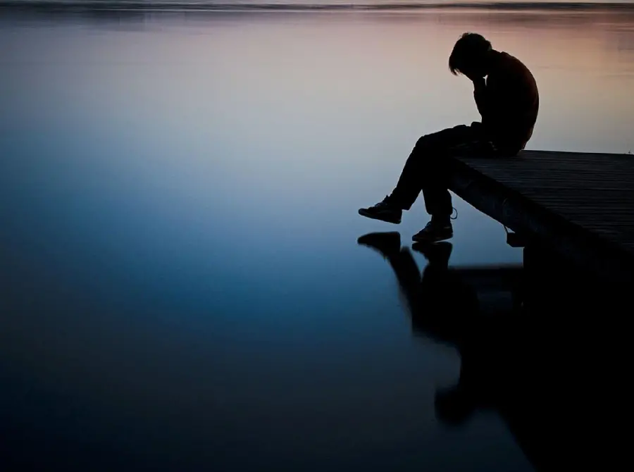 Sad boy profile picture by the sea with the highest quality 