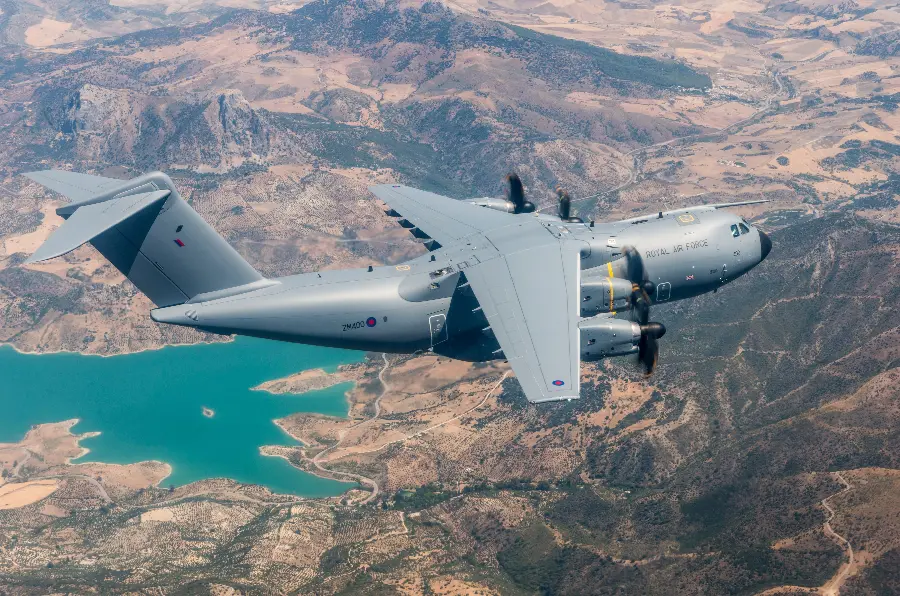 Interesting photo of a gray British plane over a blue lake landscape