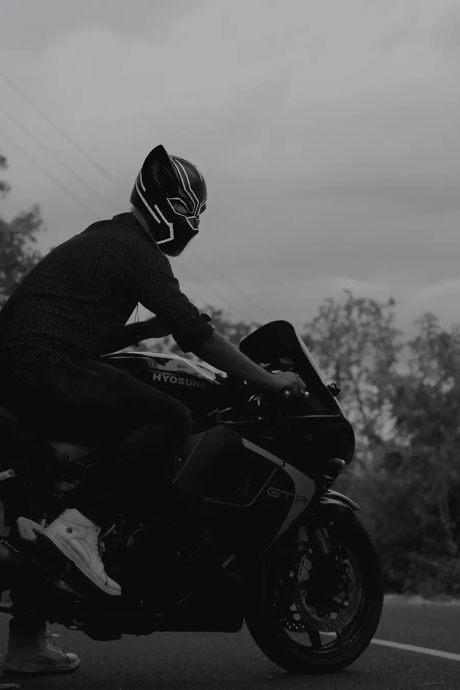 Best Black and White Mobile Wallpaper of a Motorcycle Rider with a Wolf Helmet