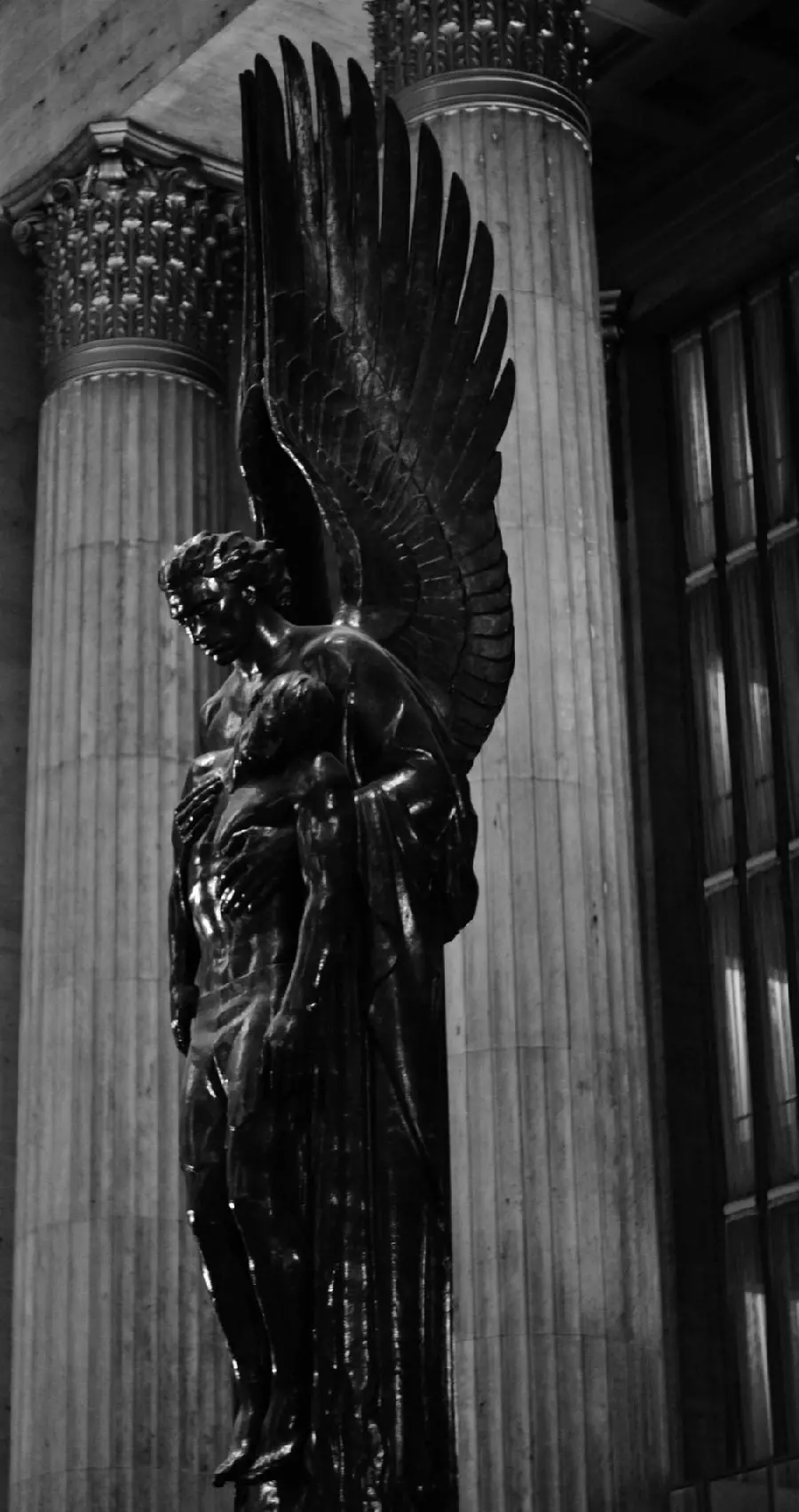 Black and White Image of a Winged Angel Stone Statue in Full HD Quality