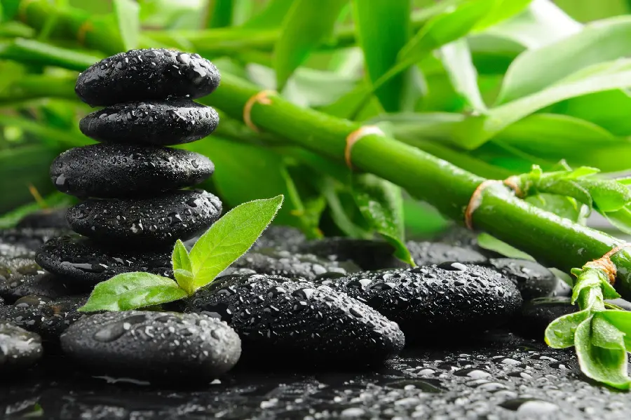 Beautiful image of black stones stacked on top of each other Zen Japanese nature 