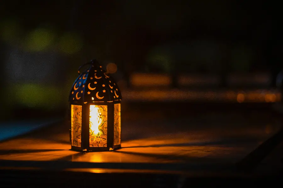 Photo of a red light lamp with a black background, an Islamic spiritual atmosphere 