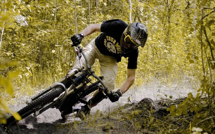 Download photo of a cyclist in an amazing forest with interesting movements