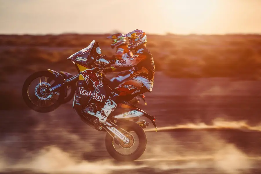 Attractive photo of Red Bull team riders in the international Dakar Rally in the desert