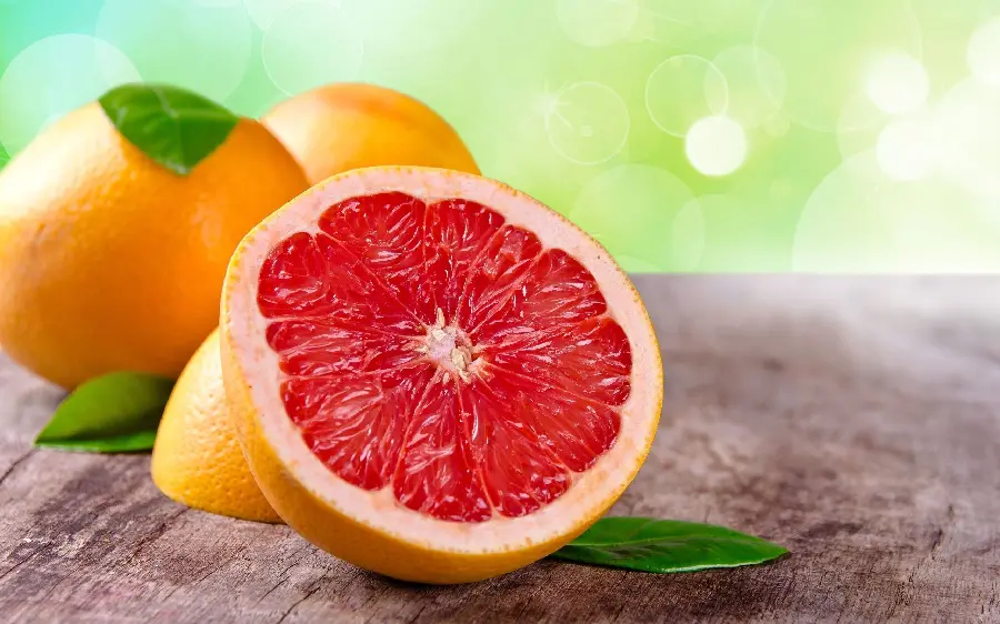 A charming and spectacular portrait of grapefruit slices on a wooden trunk