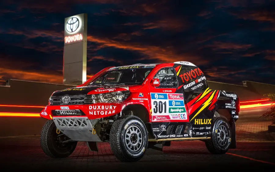 Official photo of the red Toyota Hilux, the top participant in the Dakar Rally