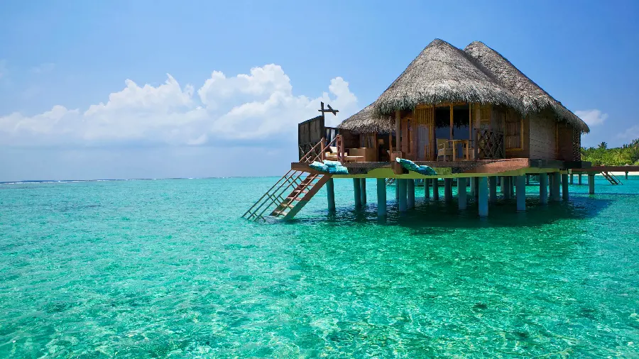 Stock Photo of a Small and Luxurious Wooden Hut on the Tropical Waves