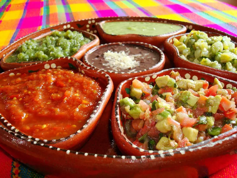 Attractive background of delicious Mexican sauces with different flavors 