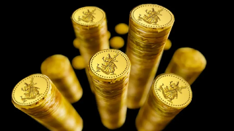 Stock photo of coins stacked on top of each other with a black background