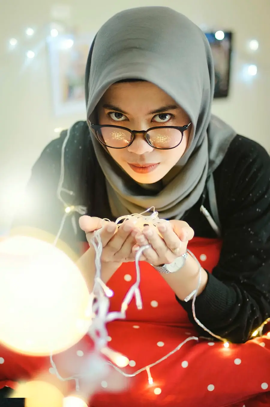 Stock photo of a girl with a hijab, very artistic and graphic and expressive glasses
