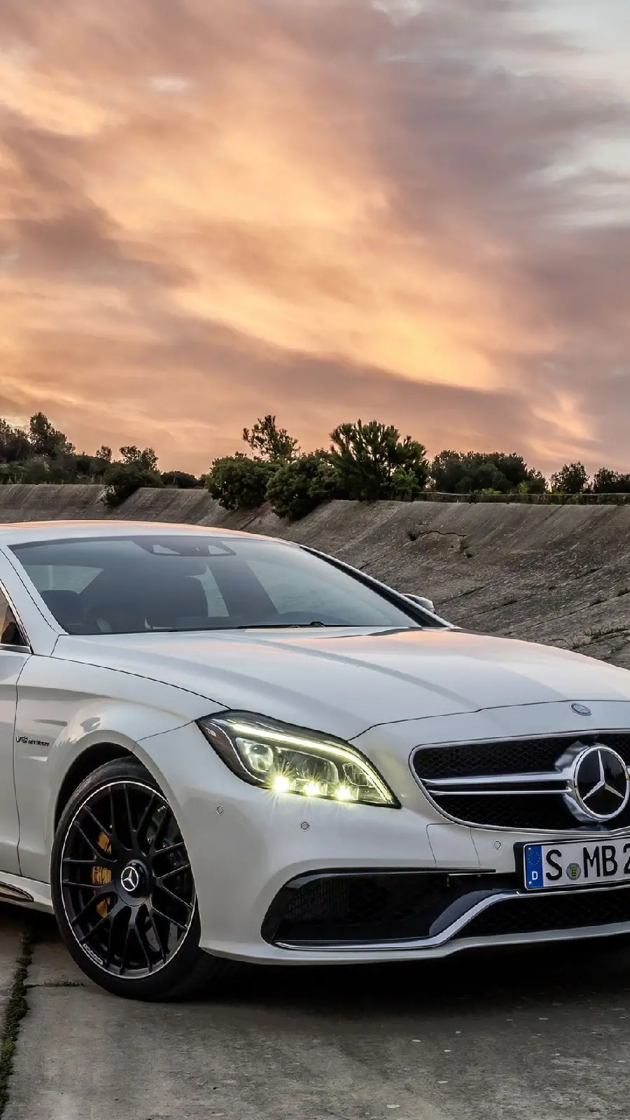 White Benz car wallpaper on the road with a beautiful background for iPhone phone and laptop wallpaper 