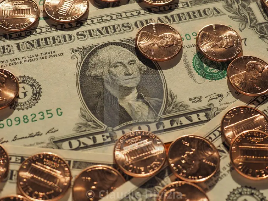 Download new photo near gold coins and US dollar bills 