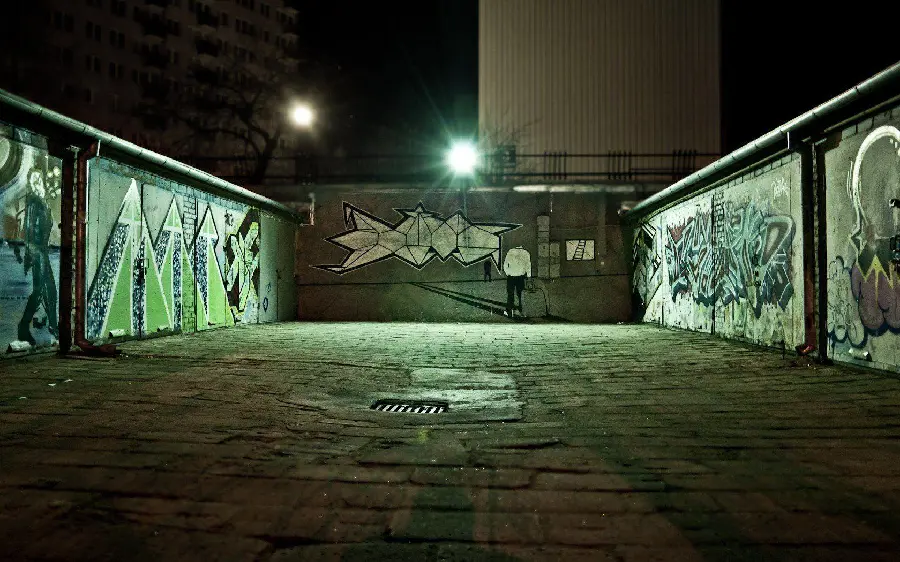 Scary photo of interesting and spectacular graffiti style graffiti at night