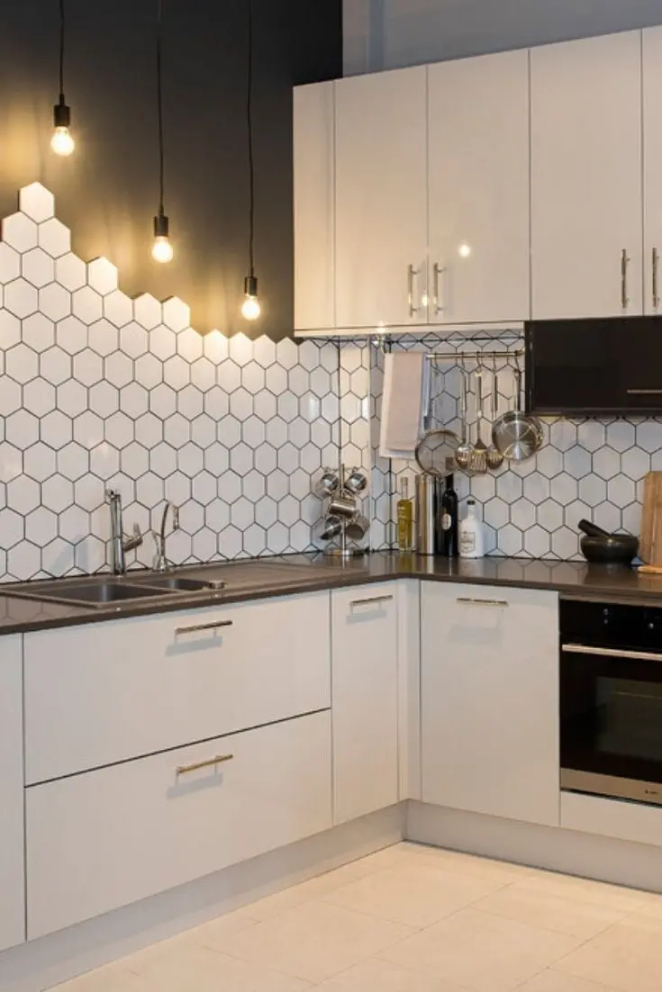 Beautiful photo of a white kitchen with a honeycomb poster 