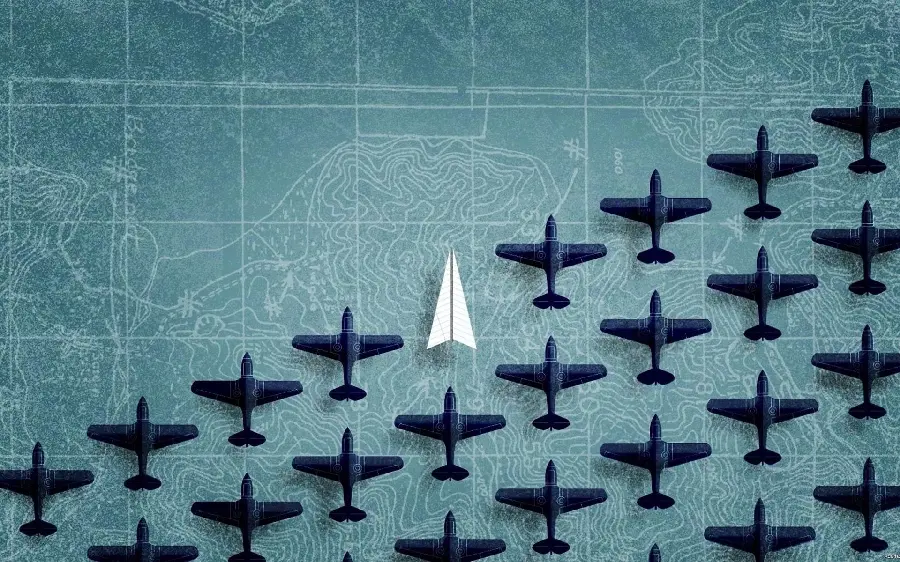 Interesting picture of a white paper plane among warplanes