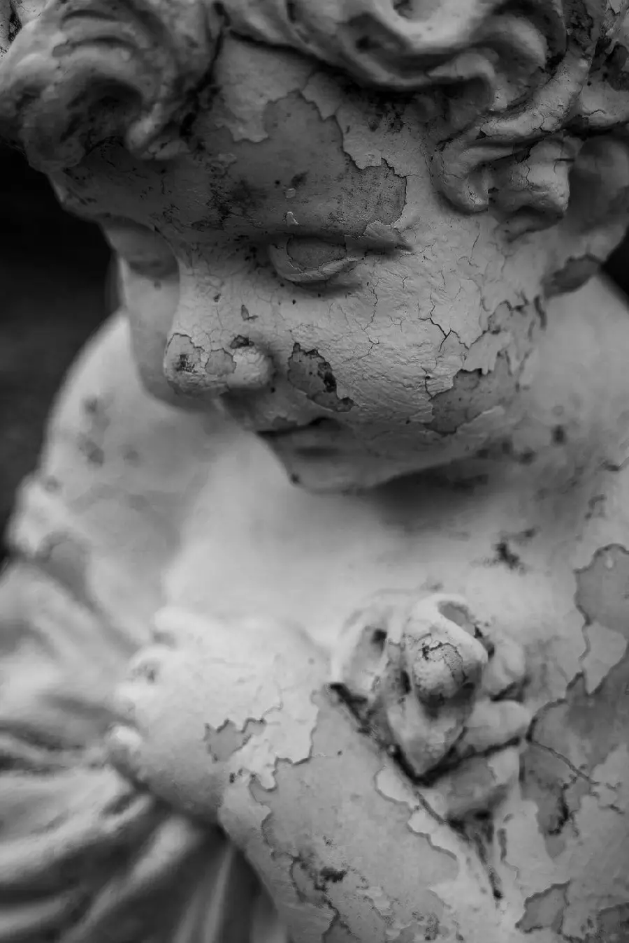 Download the most beautiful image of a stone statue of a winged angel 