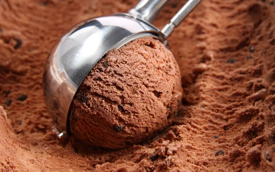 Photo of brown scoop ice cream with popular original chocolate flavor for cafe sign