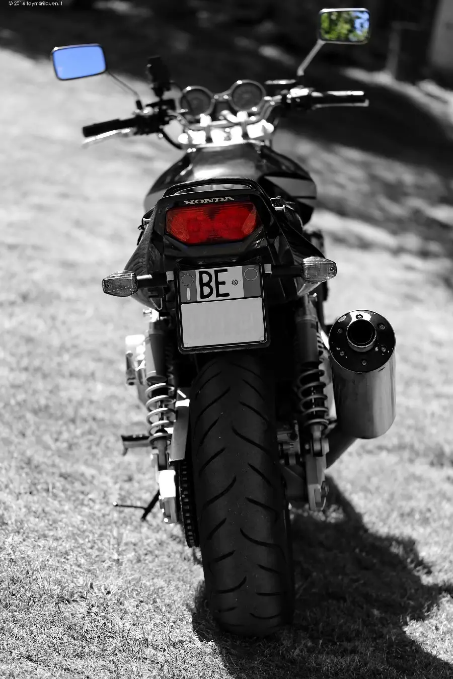The most interesting picture of the Honda CB1300 motorcycle from the back with a beautiful light