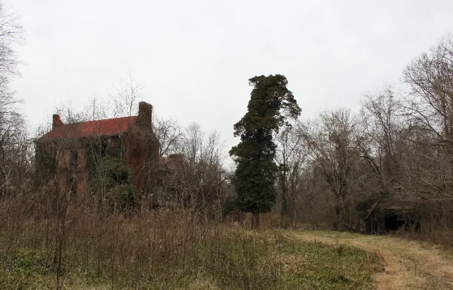 A scary background of a remote farm and an abandoned cottage