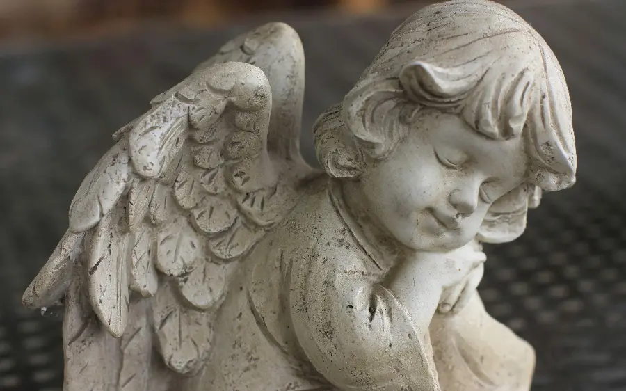 Download the most beautiful image of a stone statue of a little baby angel