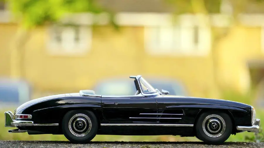 Free picture of a miniature open-top car with a simple background 