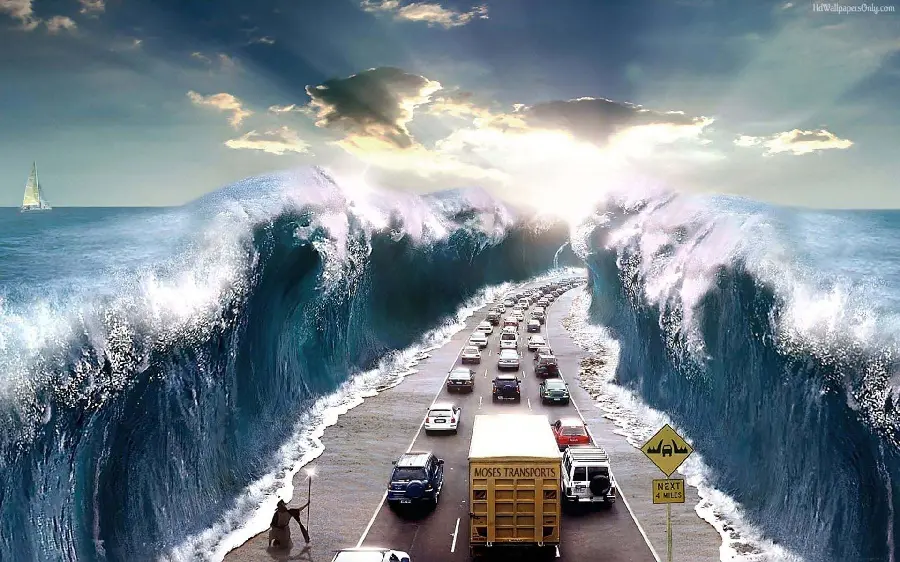 The coolest and creepiest photo of cars passing by as the sea water opens