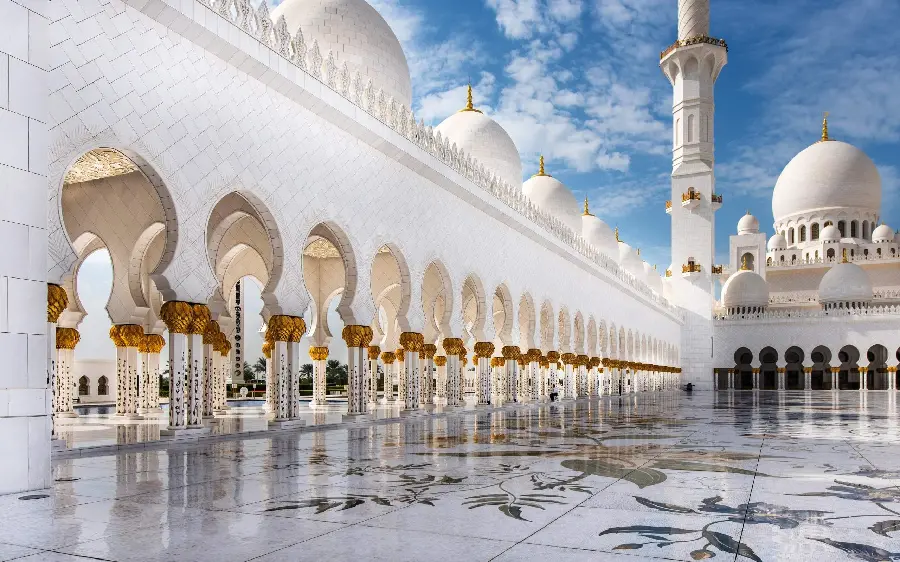 Profile photo of a beautiful white mosque with a golden moon on the dome