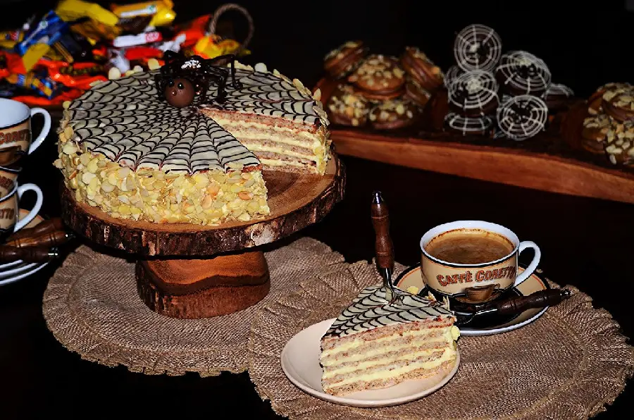Beautiful photo of a spiderweb-shaped ice cream cake with coffee 