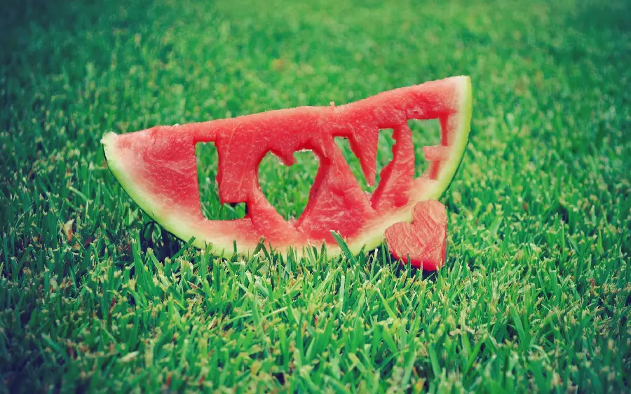 Attractive background of watermelon slices in the shape of LOVE with high quality