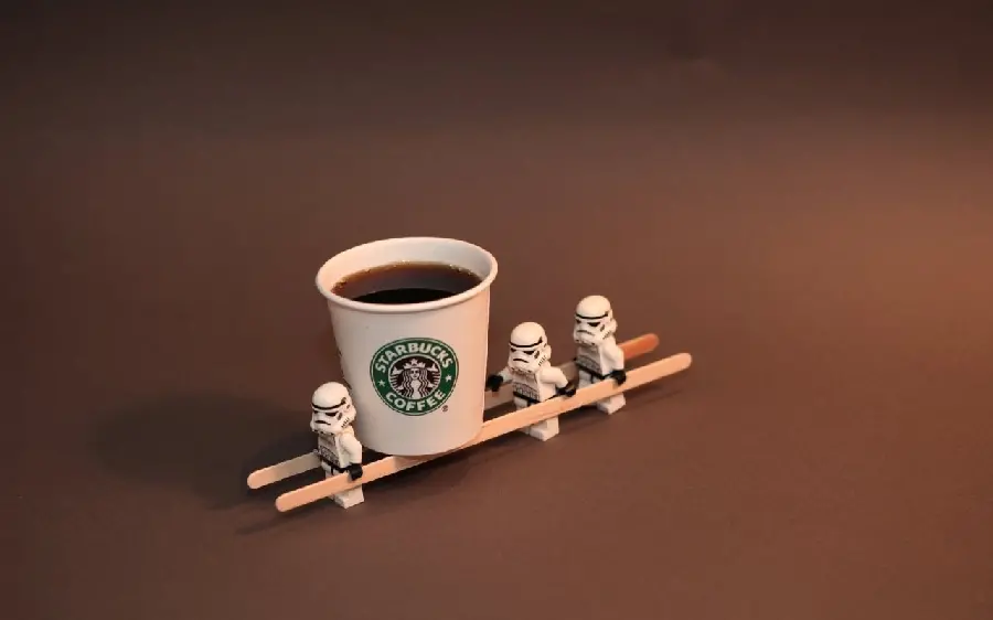 Amazing and spectacular background of Lego Star Wars next to a Starbucks cup