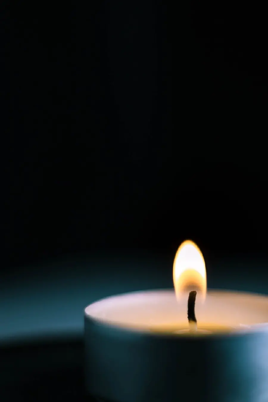 Photo of a lit candle without text for condolences to a loved one