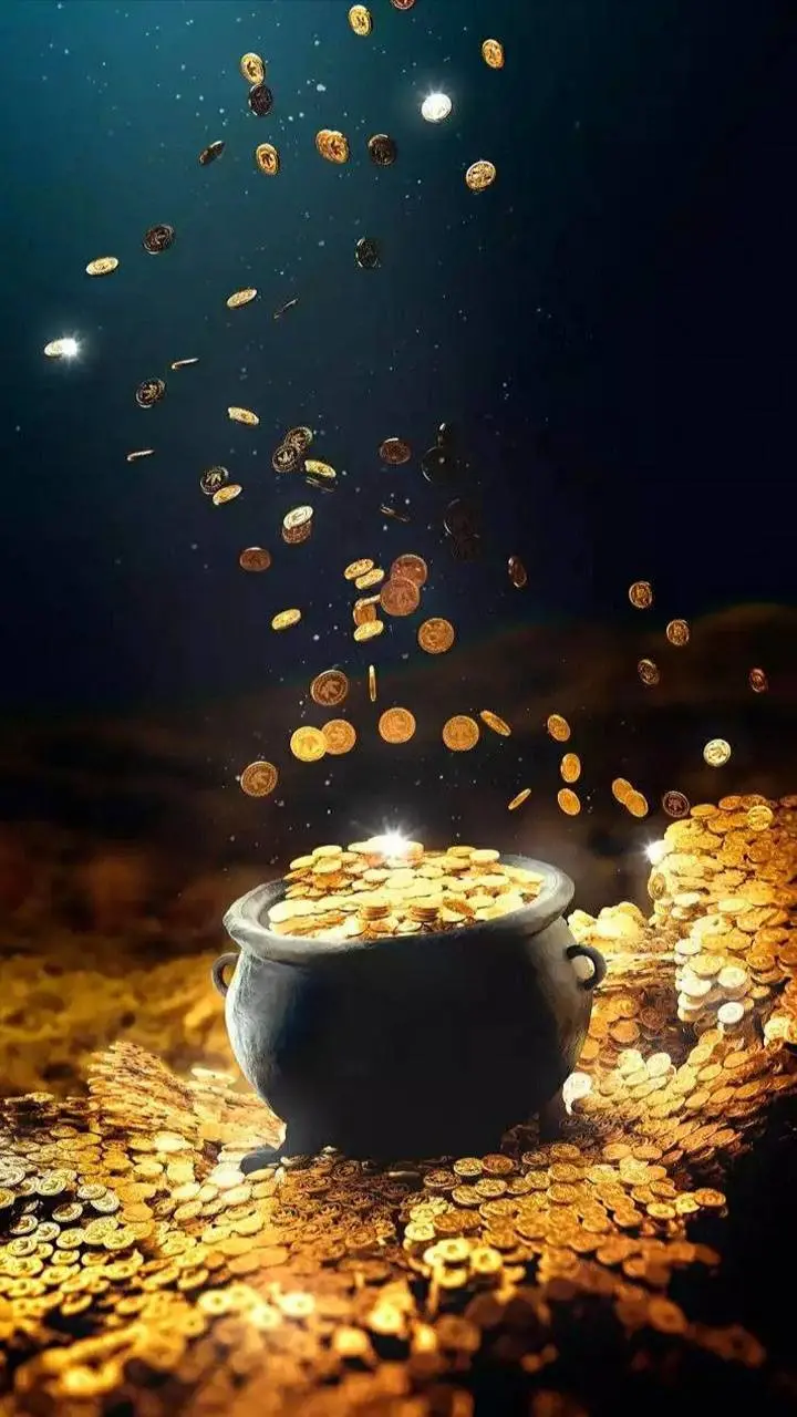 Stock photo of coins falling on a semi-dark background