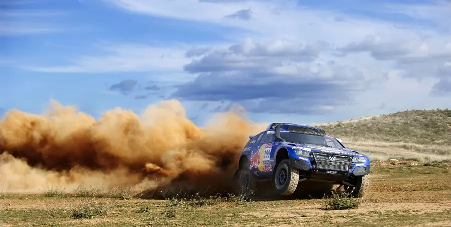 Dream photo of a blue Rolex car in the Dakar Rally for the profiles of motivated young men