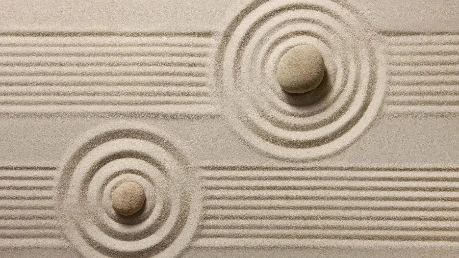 Beautiful Zen garden profile with a regular design of natural elements such as rocks and sand