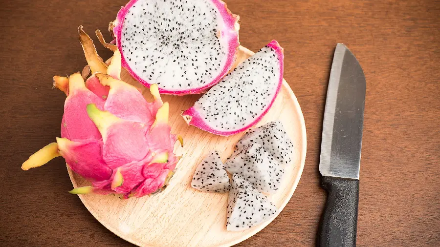 Instructional photo of how to open and cut a dragon fruit for Instagram