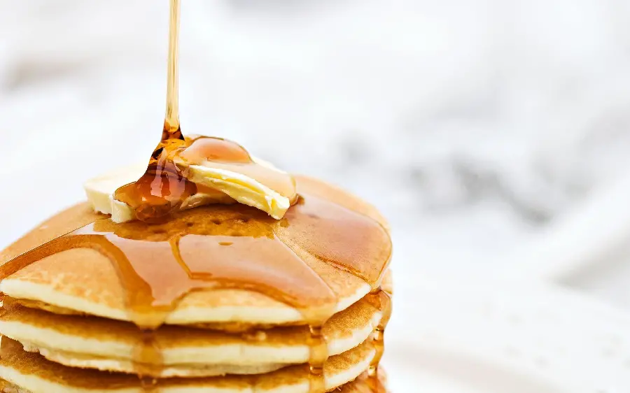 Download the photo of a decorated mini honey pancake for free and in high quality