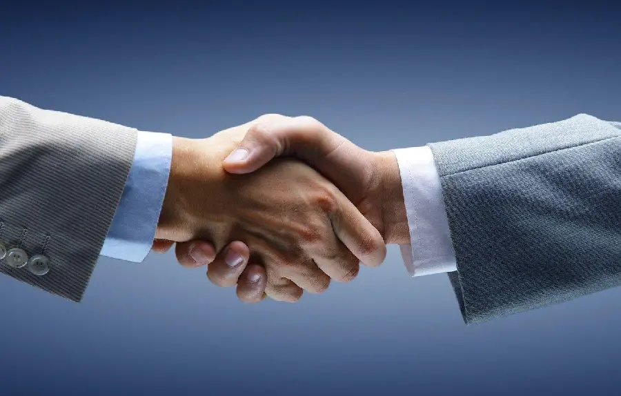 Download Handshake and Agreement Photo Suitable for Use in PowerPoint Cover 