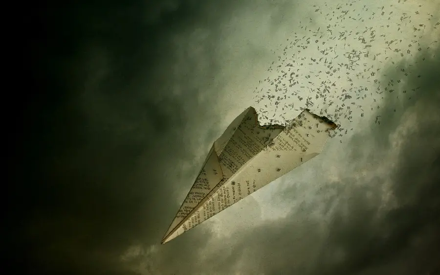 Conceptual profile photo of a paper plane falling apart