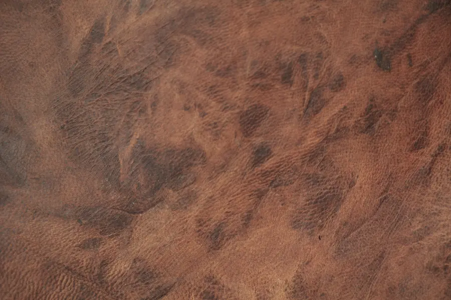 Orange brown leather texture and pattern suitable for clothing and car seat covers 